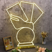 A Hand Holding Books Yellow Neon Sign