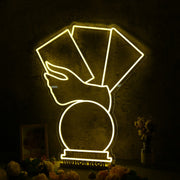 A Hand Holding Books Yellow Neon Sign