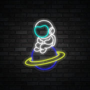 Astronaut Sitting On Planet Neon Sign