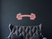 Barbell Neon Sign Hung On The Wall Of A Room