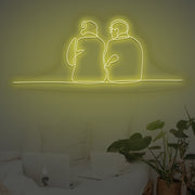 Couple Sitting Together Neon Sign