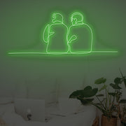 Couple Sitting Together Neon Sign