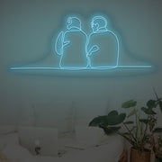 Couple Sitting Together Neon Sign