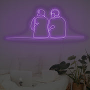 Couple Sitting Together Neon Sign