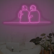 Couple Sitting Together Neon Sign