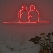 Couple Sitting Together Neon Sign