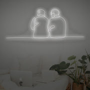 Couple Sitting Together Neon Sign