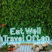 Eat Well Travel Often Blue Neon Sign