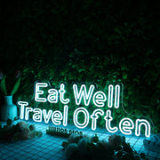 Eat Well Travel Often Blue Neon Sign