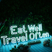 Eat Well Travel Often Blue Neon Sign