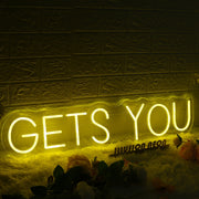 GETS YOU Yellow Neon Sign