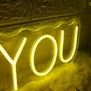 GETS YOU Yellow Neon Sign