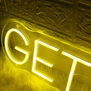 GETS YOU Yellow Neon Sign