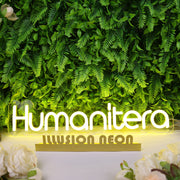 Humanitera Yellow Neon Sign