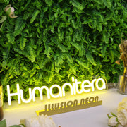 Humanitera Yellow Neon Sign