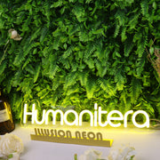 Humanitera Yellow Neon Sign