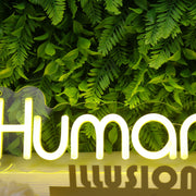 Humanitera Yellow Neon Sign