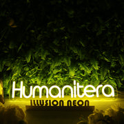 Humanitera Yellow Neon Sign