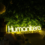 Humanitera Yellow Neon Sign