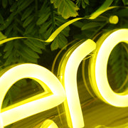 Humanitera Yellow Neon Sign