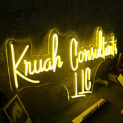 Kruah Consultants LLC Yellow Neon Sign