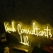 Kruah Consultants LLC Yellow Neon Sign