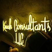 Kruah Consultants LLC Yellow Neon Sign