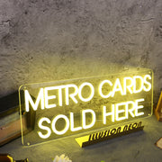 Metro Cards Sold Here Yellow Neon Sign