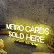 Metro Cards Sold Here Yellow Neon Sign