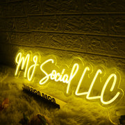 MJ Social LLC Yellow Neon Sign