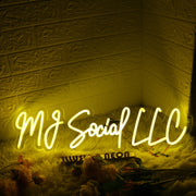 MJ Social LLC Yellow Neon Sign