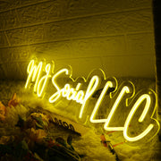 MJ Social LLC Yellow Neon Sign