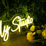 Niever Family Studio Yellow Neon Sign