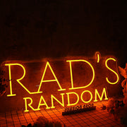 Rad's Random Orange Neon Sign