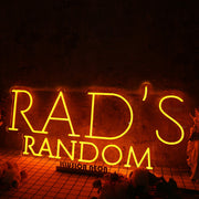 Rad's Random Orange Neon Sign