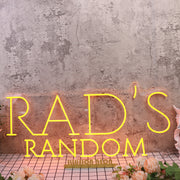 Rad's Random Orange Neon Sign