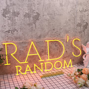 Rad's Random Orange Neon Sign