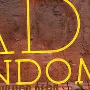 Rad's Random Orange Neon Sign