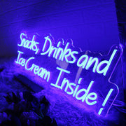 Snacks Drinks And Ice Cream Inside Blue Neon Sign