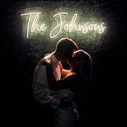 The Johnsons Neon Name Signs Warm White Neon Sign Hung On Grass Wall