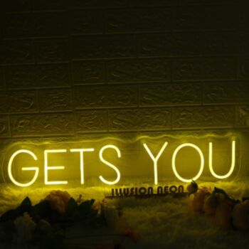 GETS YOU Yellow Neon Sign